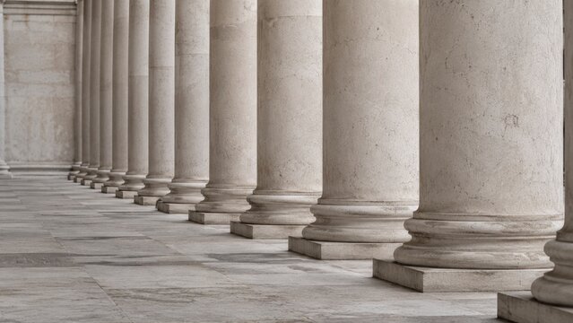 Classical marble colonnade with repeated stone columns and tiled floor in strong linear perspective