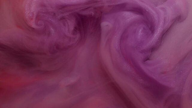 Turbulence paint. Smoke explosion. Shimmering cloud color spray flow liquid. Pink purple red fume abstract swirl blend defocused background.