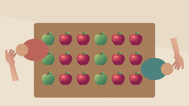 Travailleurs triant des pommes rouges et vertes sur une table de r&eacute;colte vue du dessus