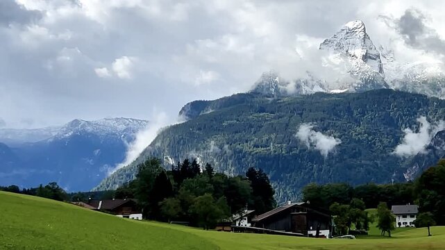 View from the valley to the snowy summit of the Jenner, Berchtesgaden, Bavaria, Germany