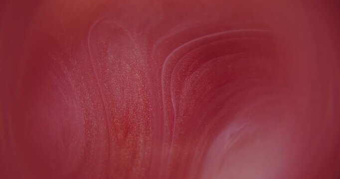 Blur paint flow. Shimmer splash. Red pink color glitter rainbow texture bright pigment vibrant wet particles spreading on abstract background.