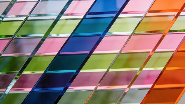 close-up of rectangular translucent glass stripes shifted sideways in a precise irregular pattern