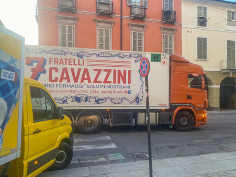 Fratelli Cavazzini branded truck carrying food products on a city street, delivering fresh goods