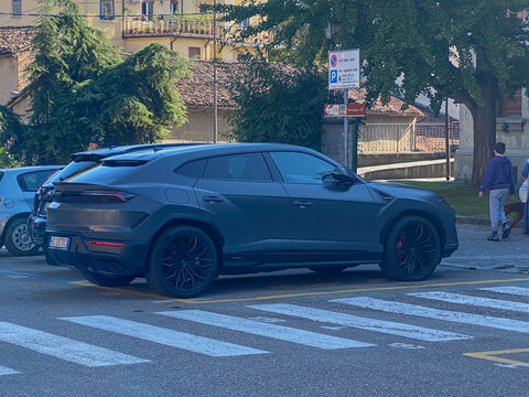 Lamborghini Urus matte black luxury SUV parked in an urban setting, representing power and modern design