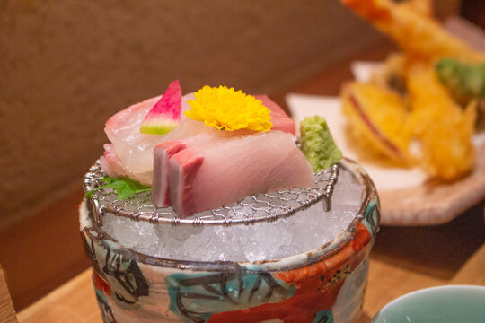 Top down view of Japanese amberjack or hamachi or yellowtail sashimi on ice - Japanese cuisine. Kumamoto, Kyushu, Japan