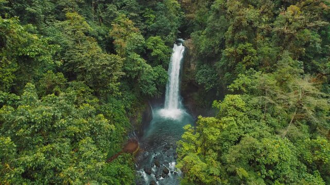Aerial view of La Paz waterfall pool in lush tropical jungle of Costa Rica