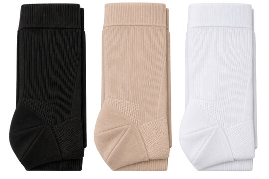 Women's ribbed knee high sock three-pack, ribbed cotton knit, black, nude beige and white, wide cuff and reinforced heel. Flat lay isolated on white background for hosiery retail.