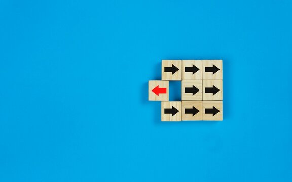 Wooden square block the red arrow symbol turns to the opposite direction of black arrows symbol.
