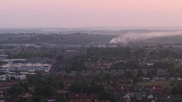Aerial view of Wakefield, a cathedral city located on the River Calder in West Yorkshire, England, United Kingdom. Drone POV exploration of city centre and surrounding infrastructure in early mornings