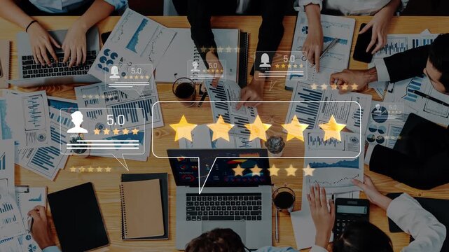 A top view of a diverse team engaged in discussions with laptops and documents, showcasing performance ratings and feedback symbols amidst various charts and data reports. Raster