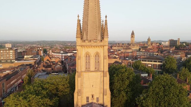 Aerial view of Wakefield, a cathedral city located on the River Calder in West Yorkshire, England, United Kingdom. Drone POV of Wakefield Cathedral  and city centre in early mornings sunrise.
