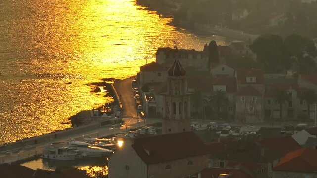 Tele Zoom on old town of Sutivan in thick smog from dalmatian coast wildfires.
