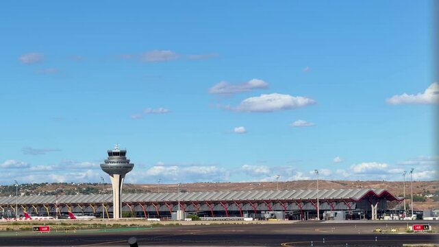Aircrafts taxing toward its assigned gates after landing, preparing for passenger disembarkation in Madrid Barajas International Airport, Spain