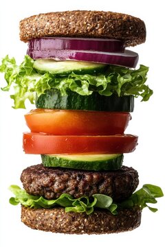 floating veggie burger with lettuce, tomato, avocado, and vegan patty, isolated on white background