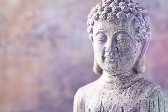 Meditating Buddha Statue on wooden background. Soft focus. Close up. Copy space
