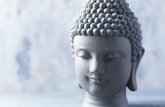 Meditating Buddha Statue on wooden background. Soft focus. Close up. Copy space