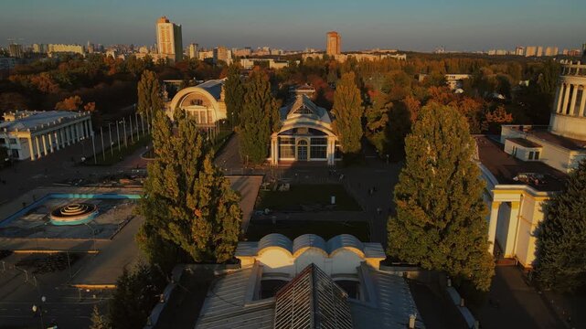 Aerial view over historic exhibition pavilions and park trees at VDNH in Kyiv
