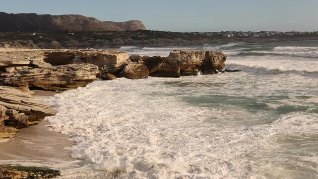 glorious Walker Bay Nature Reserve and massive wave sets, in late afternoon light , South Africa