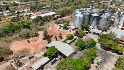 Grain silos and trucks at an industrial facility in South Kalimantan © Salsabila Ariadina