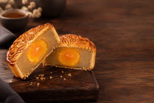 Mid-Autumn Mooncake with Egg Yolk on Wooden Table