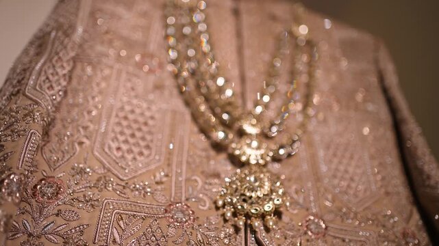 Traditional Indian groom sherwani with layered pearl necklace in Lucknow