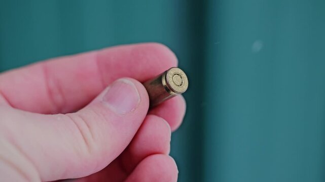 Close-up ammunition round evokes depleted stocks and wartime industry pressure