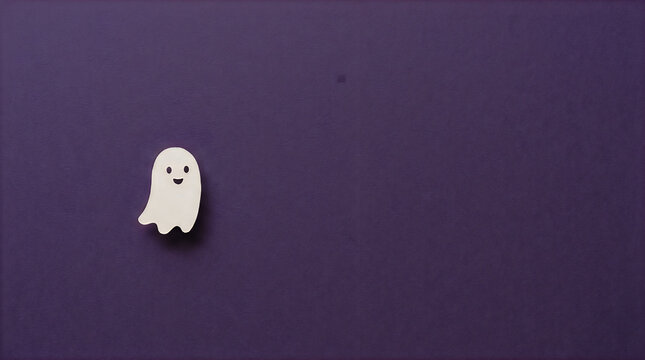 Small cute paper ghost on dark purple background