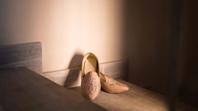 Traditional Indian wedding mojari shoes placed on stairs in Lucknow Uttar Pradesh