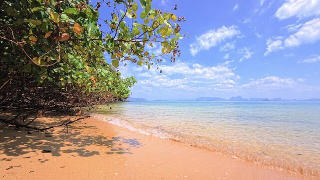 Paradise beach with sand and turquoise water on a tropical island in Phang Nga Bay, Thailand