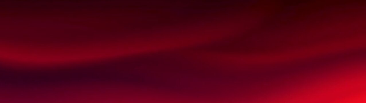 Rich ruby textile surface showcasing gentle undulating curves This deep crimson material provides a luxurious and smooth backdrop.