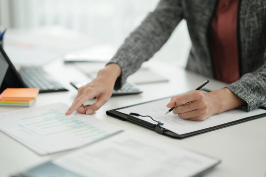 Financial inspector calculating a numbers in office room
