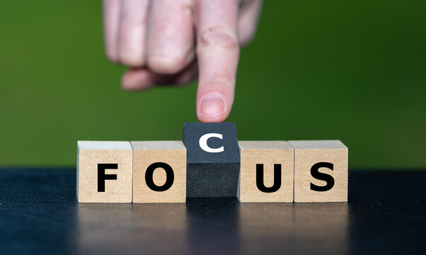 Hand completes FOCUS on cubes for concentration and priorities