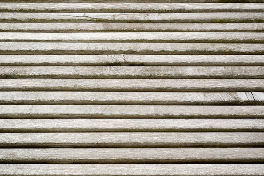 Background created from a close-up of an outdoor deck made of wooden slats.