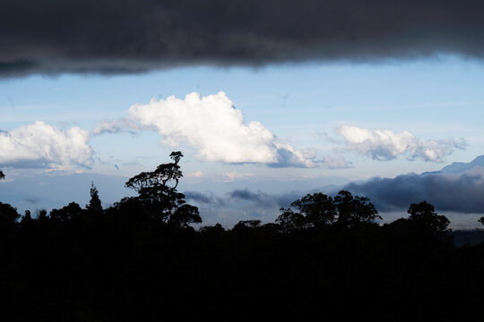 Clouds Rolling Over Mountain Slopes