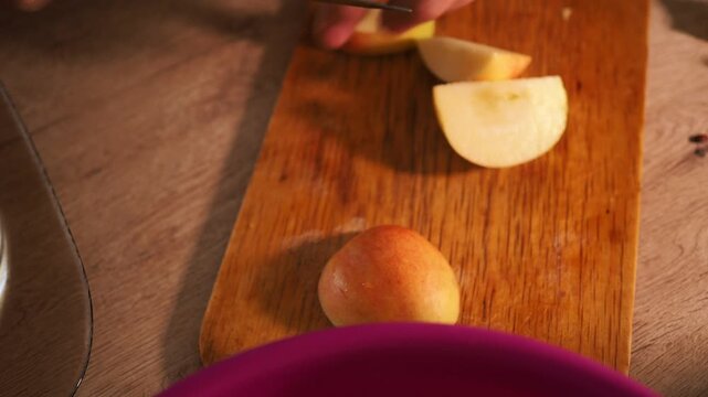 a man cutting apples for a pie