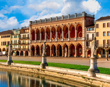 beautiful city view of an urban landscape with park chanel with blue water and monuments and historic european buildings on background. Autumn season city landscape