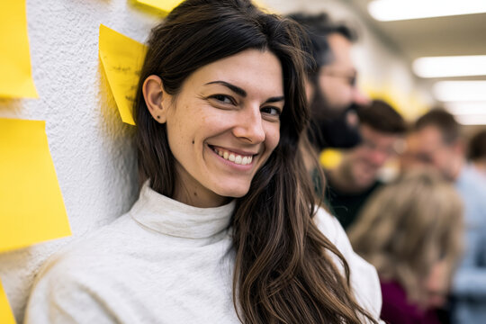 Modern artwork of university students brainstorming ideas on sticky notes during a group discussion in a creative learning space, modern educational design, bright natural light, realistic commercial
