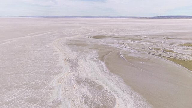 Aerial Forward Tracking Shot Over Barren Salt Flat