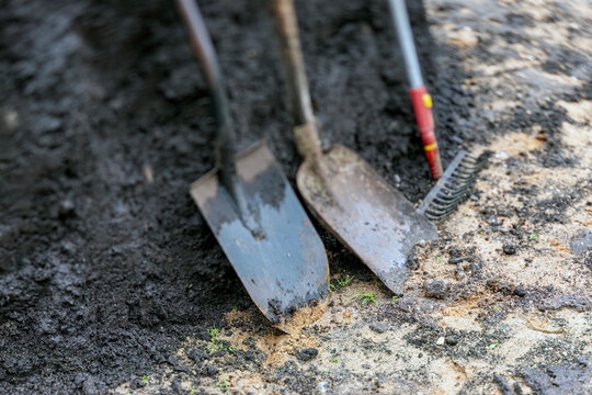 black soil, rake and shovels