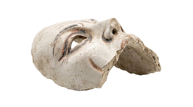 Antique ceramic theater mask fragment, weathered white clay theatrical sculpture, ancient greek style drama mask artifact with hand-painted details isolated PNG with Transparent Background