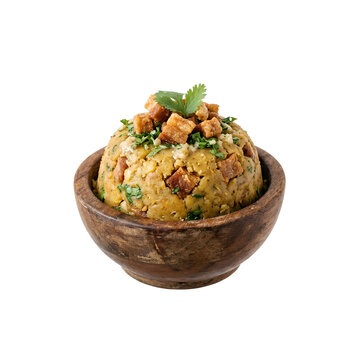 Puerto Rican mofongo in a wooden bowl topped with crispy pork cracklings isolated PNG. Traditional Puerto Rican dish isolated