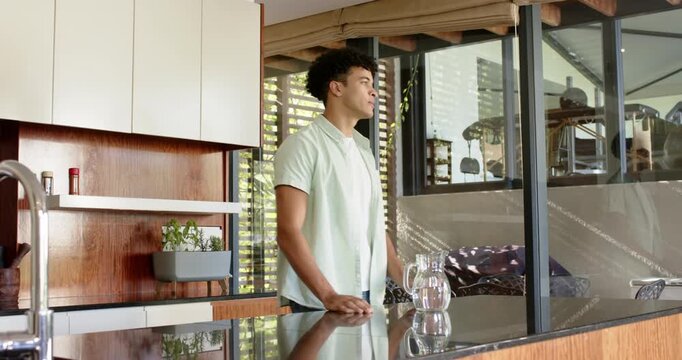 Lifestyle videos indoor of people doing activities at home, Drinking water from glass, man standing