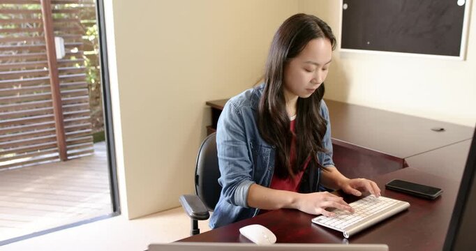 Lifestyle videos indoor of people doing activities at home, typing on keyboard, woman working from h