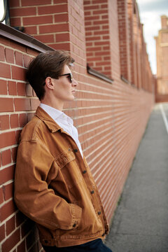 Guy Against Brickwall