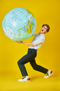 Student Carrying Globe