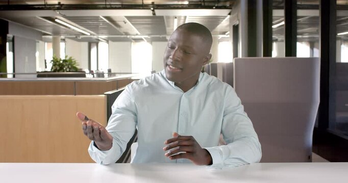 Close up of people talking to the camera, businessman in office, gesturing with hands