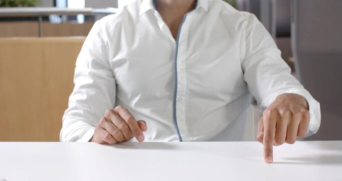 Close up of people talking to the camera, pointing at table, man in white shirt gesturing during bus