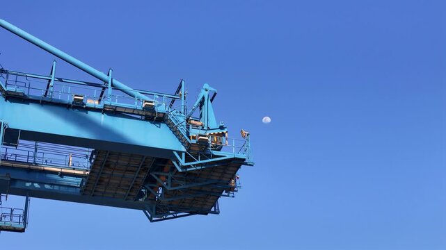 Gantry crane structure against clear blue sky at the port of Manzanillo, Mexico