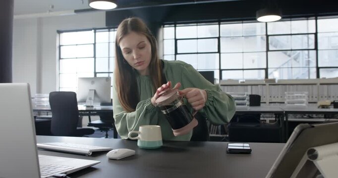 Lifestyle videos indoor of people doing activities at office, drinking coffee, woman working on lapt
