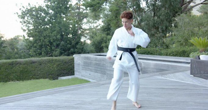Lifestyle videos outdoor of people doing activities , practicing martial arts, man in karate uniform